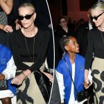 Charlize Theron brings daughter August, 7, to sit front row at Dior fashion show