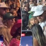 Travis Kelce protectively wraps his arms around Taylor Swift while dancing in the crowd at Coachella