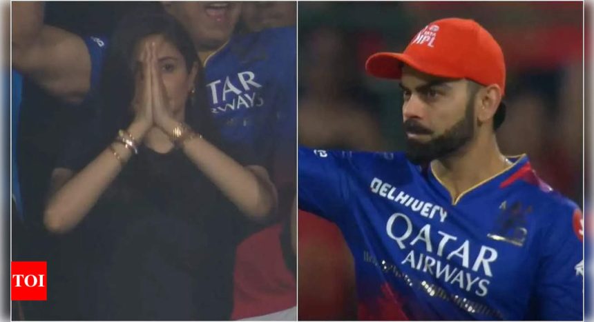 Virat Kohli points to Anushka Sharma as she celebrates RCB's win with gratitude towards the Almighty | Hindi Movie News