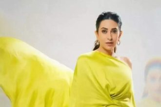 Karisma raises the bar in a neon asymmetrical gown