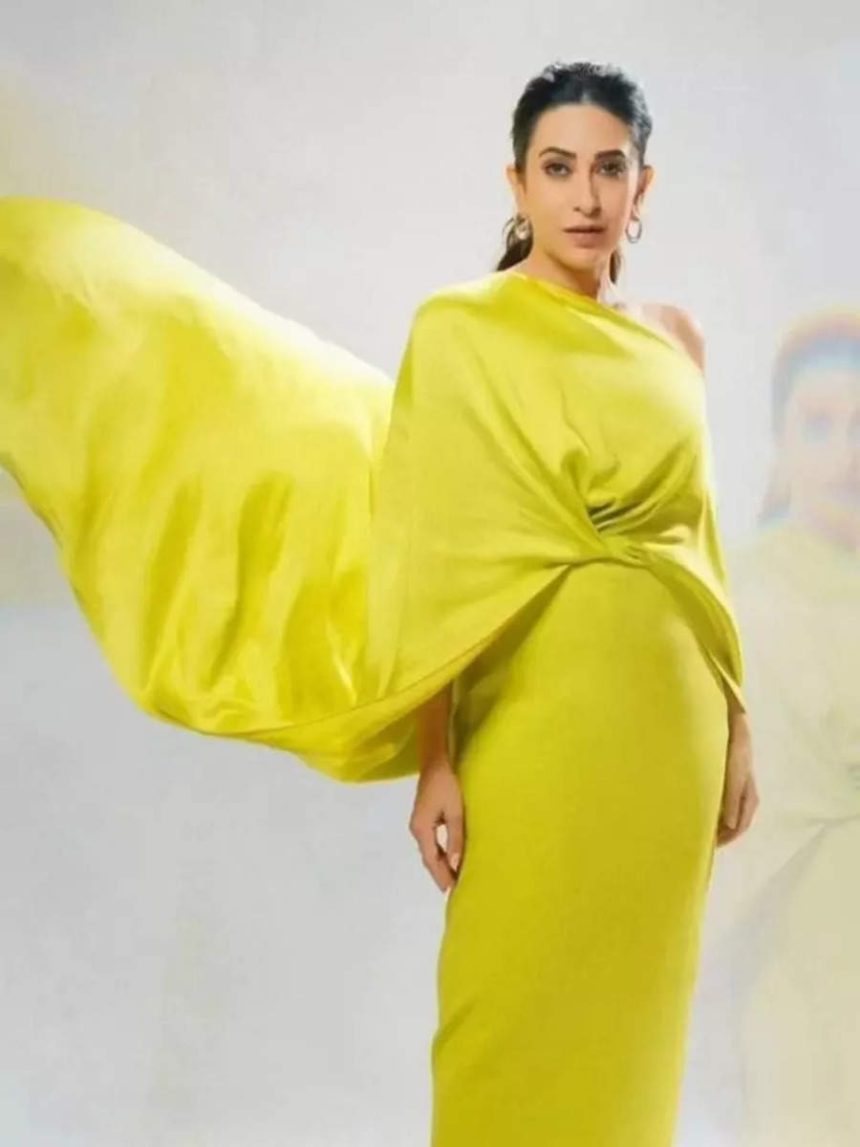 Karisma raises the bar in a neon asymmetrical gown