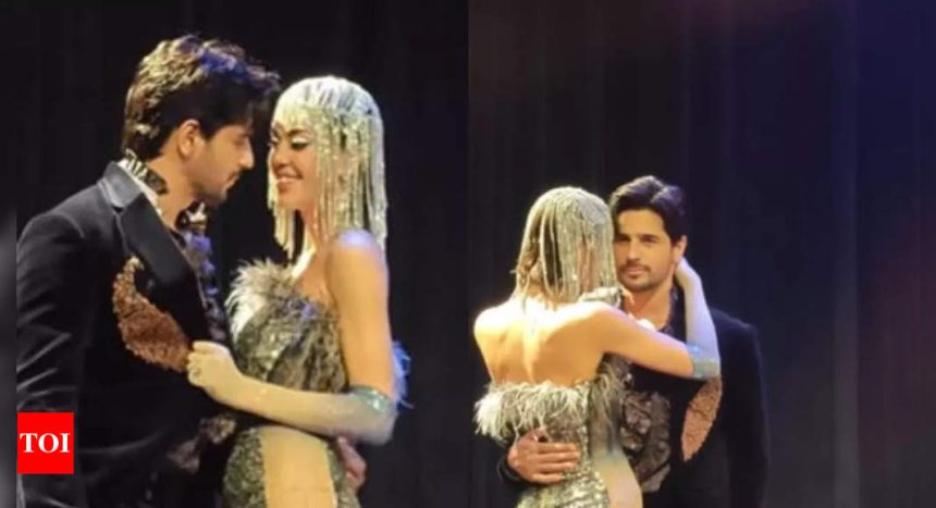 Netizens say, 'Kiara bhabhi will be waiting with slipper at home' as Sidharth Malhotra goes cosy with a model on the ramp - WATCH VIDEO | Hindi Movie News